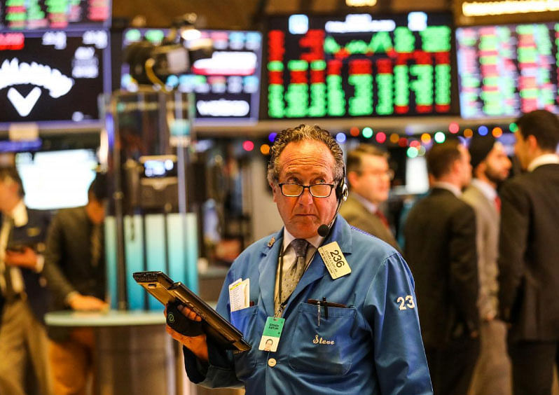 Traders work on the floor of the New York Stock Exchange (NYSE) in New York, on 28 December 2018. -- File photo: Reuters