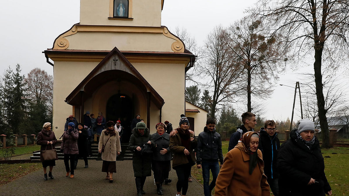 Parishioners leave the church after the mass in Kalinowka, Poland on 25 November. Photo: Reuters