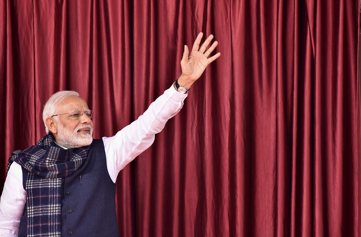 Indian Prime Minister Narendra Modi waves to the crowd as he arrives in Medininagar on 5 January 2019, during a campaign sweep through Jharkhand state to inaugurate development projects. Photo: AFP