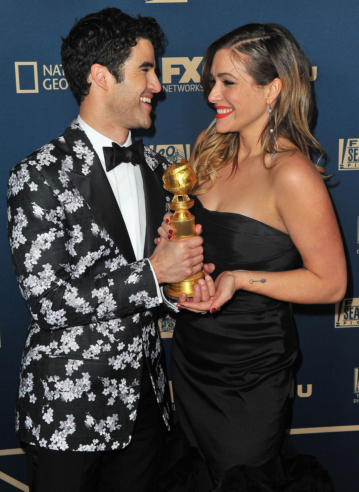 Darren Criss (L), winner of Best Performance by an Actor in a Limited Series or Motion Picture Made for Television, and Mia Swier attend the FOX, FX And Hulu 2019 Golden Globe Awards After Party at The Beverly Hilton Hotel on 6 January 2019 in Beverly Hills, California. Photo: AFP