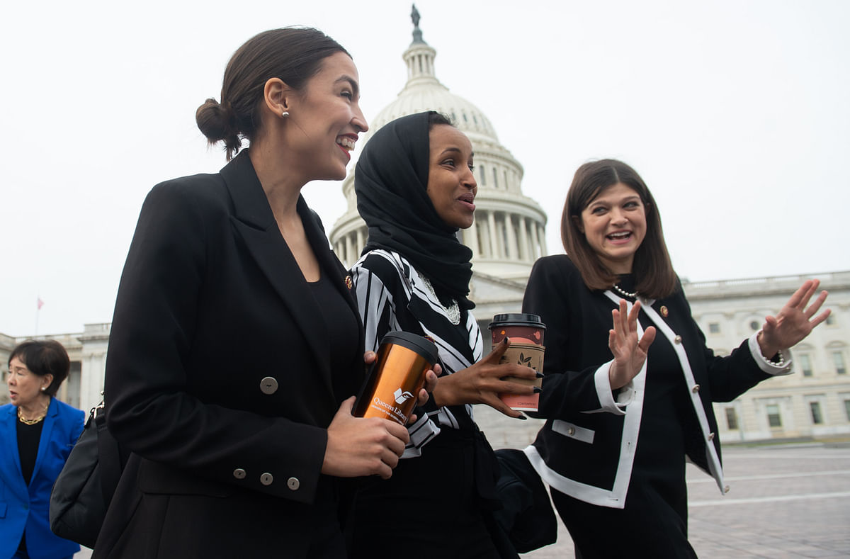 US Representative Alexandria Ocasio-Cortez, Democrat of New York; US Representative Ilhan Omar (C), Democrat of Minnesota; and US Representative Haley Stevens (R), Democrat of Michigan, arrive for a photo opportunity with the female House Democratic members of the 116th Congress outside the US Capitol in Washington, DC, on 4 January 2019. -- Photo: AFP