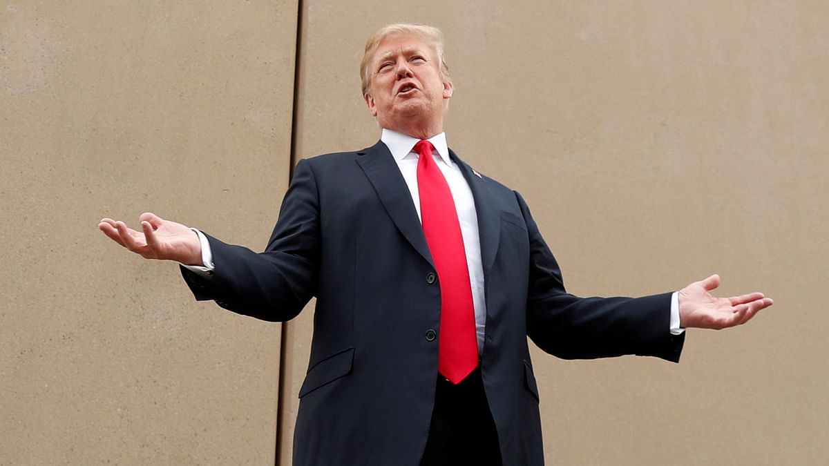 US president Donald Trump speaks while participating in a tour of US-Mexico border wall prototypes near the Otay Mesa Port of Entry in San Diego, California US on 13 March. Photo: Reuters