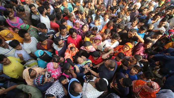 Locals lay siege in Dhaka`s Gendaria protesting against two-year-old Ayesha Moni`s death. Photo: Abdus Salam