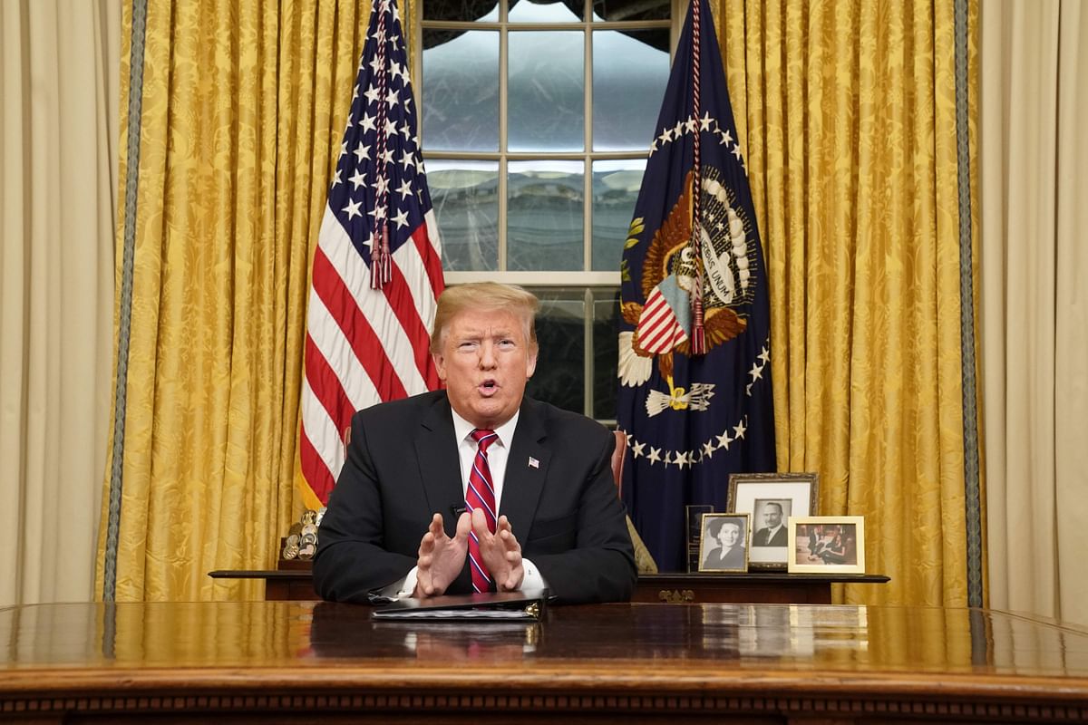 US president Donald Trump delivers a televised address to the nation on funding for a border wall from the Oval Office of the White House in Washington DC on 8 January 2019. Photo: AFP
