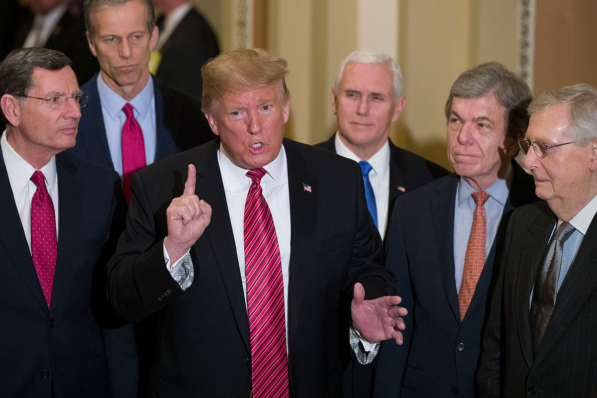 Sen. John Barrasso, R-Wyo., left, and Sen. John Thune, R-S.D., stand with President Donald Trump, Vice President Mike Pence, Sen. Roy Blunt, R-Mo., and Senate Majority Leader Mitch McConnell of Ky., as Trump speaks while departing after a Senate Republican Policy luncheon, on Capitol Hill in Washington, Wednesday, 9 January 2019. Photo: AP