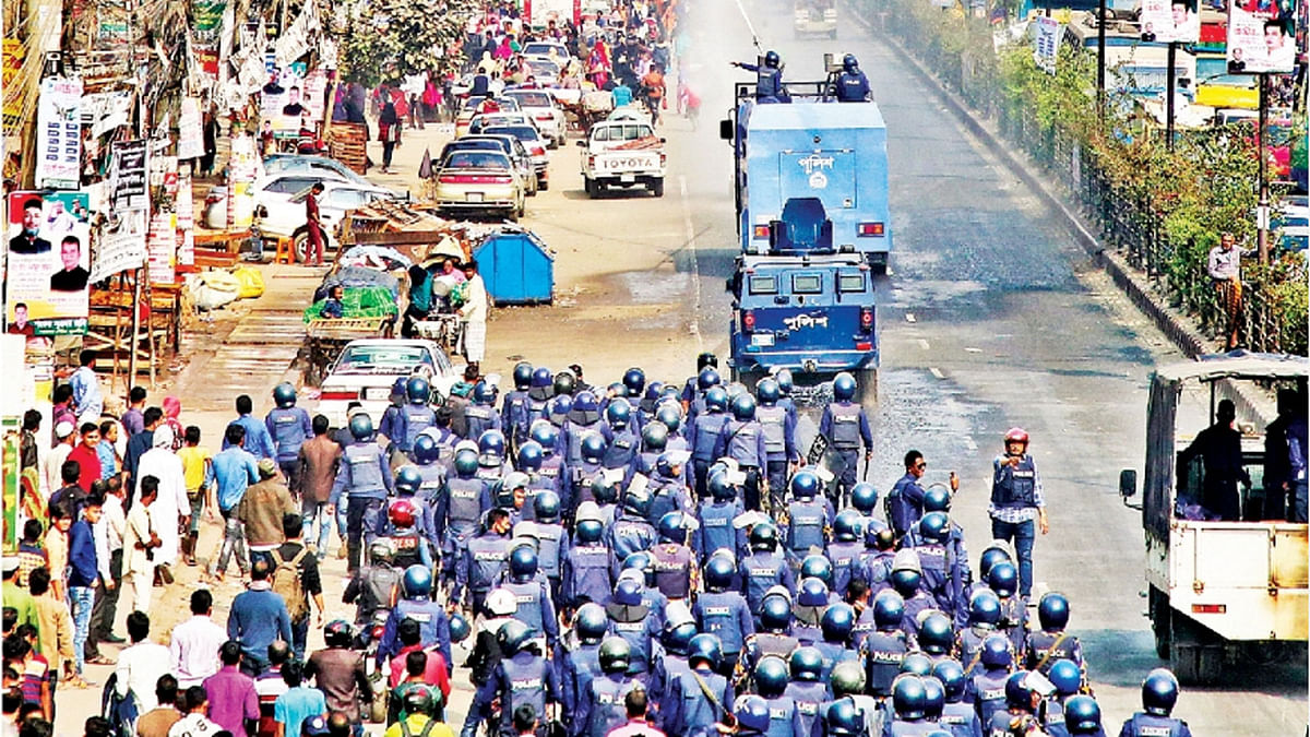 Police use water cannons to disperse the agitating garments workers demanding wage hike at Savar bus stand Wednesday. Photo: Suvra Kanti Das