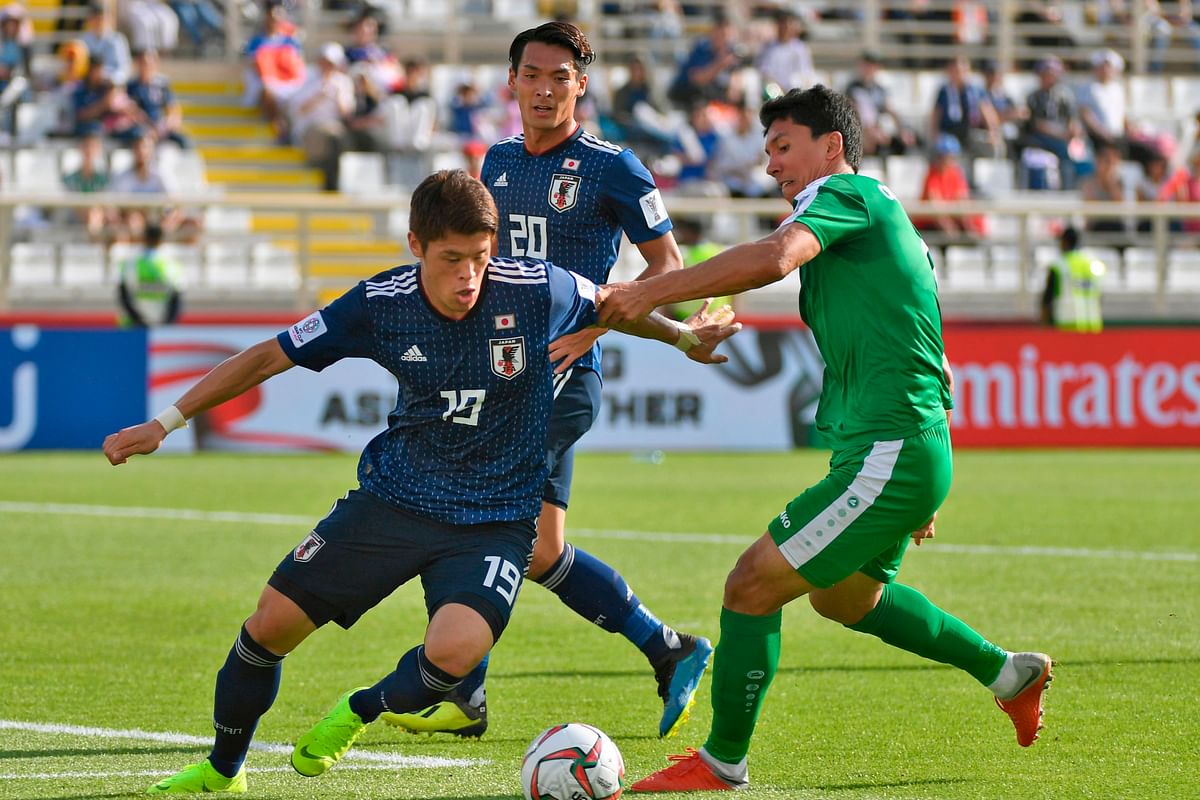 Japan: Japan`s defender Hiroki Sakai plays the ball eyed by teammate Japan`s defender Tomoaki Makino during their Group F, UAE 2019 Asian Cup football match between Japan and Turkmenistan at the al-Nahyan Stadium in Abu Dhabi on 9 January 2019. Photo: AFP