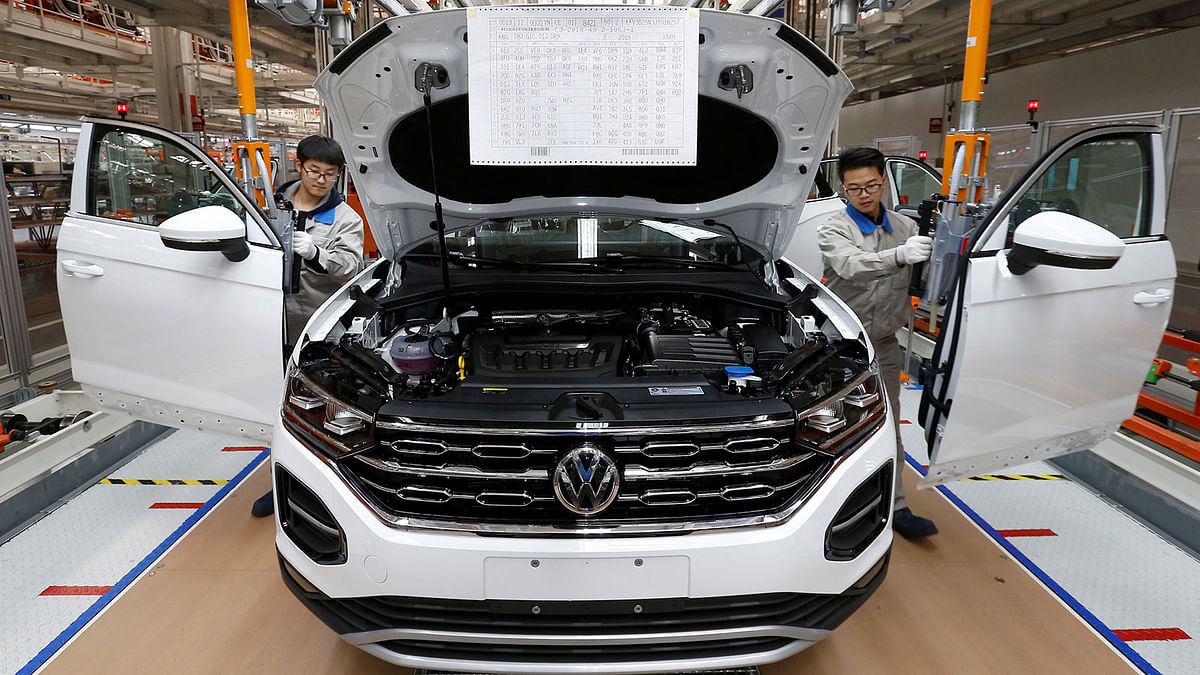 Workers are seen at the production line for Volkswagen Tayron cars at the FAW-Volkswagen Tianjin Plant in Tianjin, China on 12 December 2018. Photo: Reuters