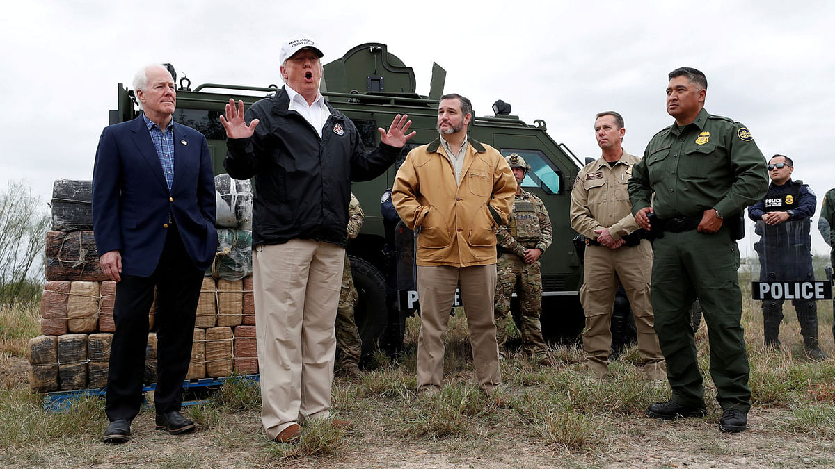 President Donald Trump speaks to reporters as he visits the banks of the Rio Grande River with Senator John Cornyn (R-TX), Senator Ted Cruz (R-TX) and US Customs and Border Patrol agents during the president`s visit to the US - Mexico border in Mission, Texas, US on 10 January. Photo: Reuters