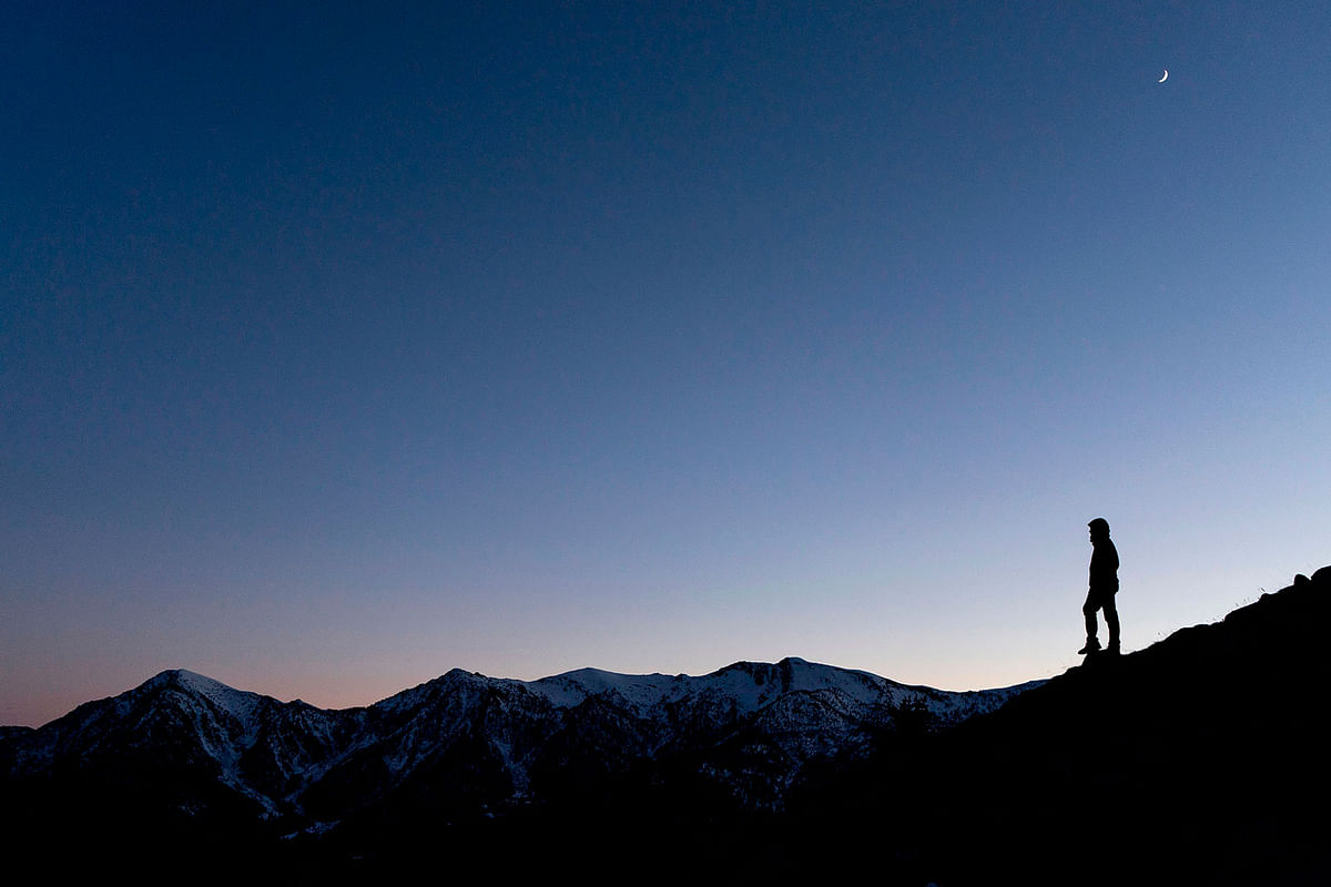 A man walks in the Alps region on the Puy of Sampeyre, in the Varaita Valley, northwest Italy, on 10 January 2018. Photo: AFP