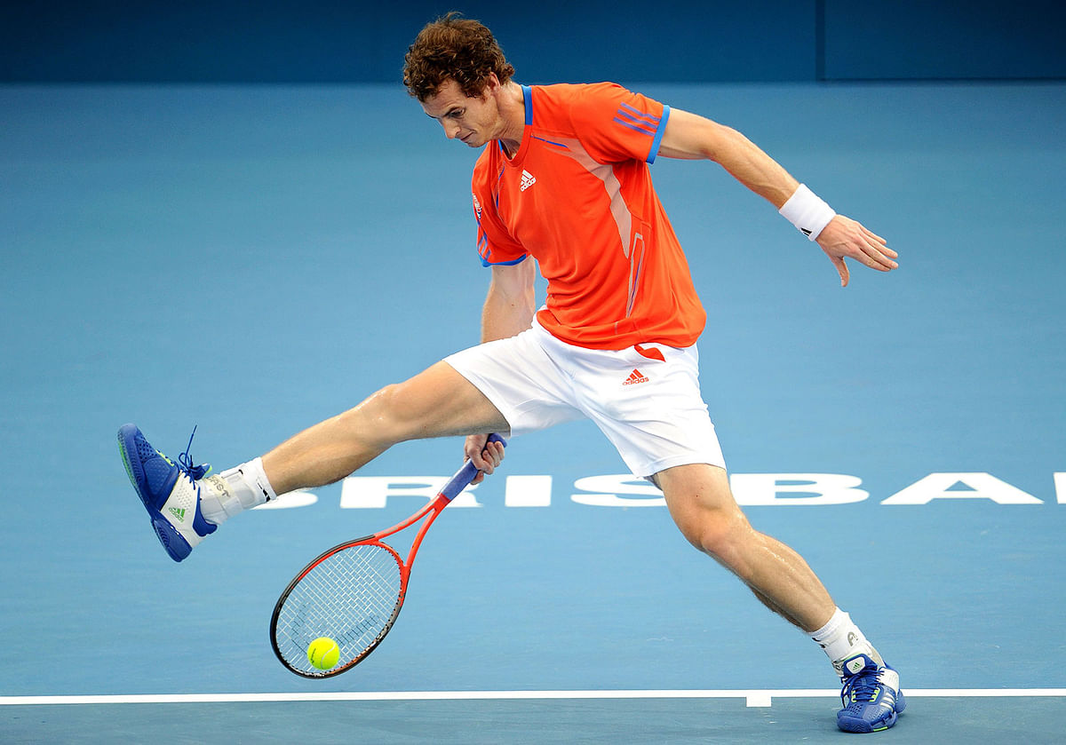 In this file photo taken on 6 January 2012 Andy Murray of Britain hits a shot between his legs on the way to winning his quarter-final match against Marcos Baghdatis of Cyprus, at the Brisbane International tennis tournament in Brisbane on 6 January 2012. AFP File Photo