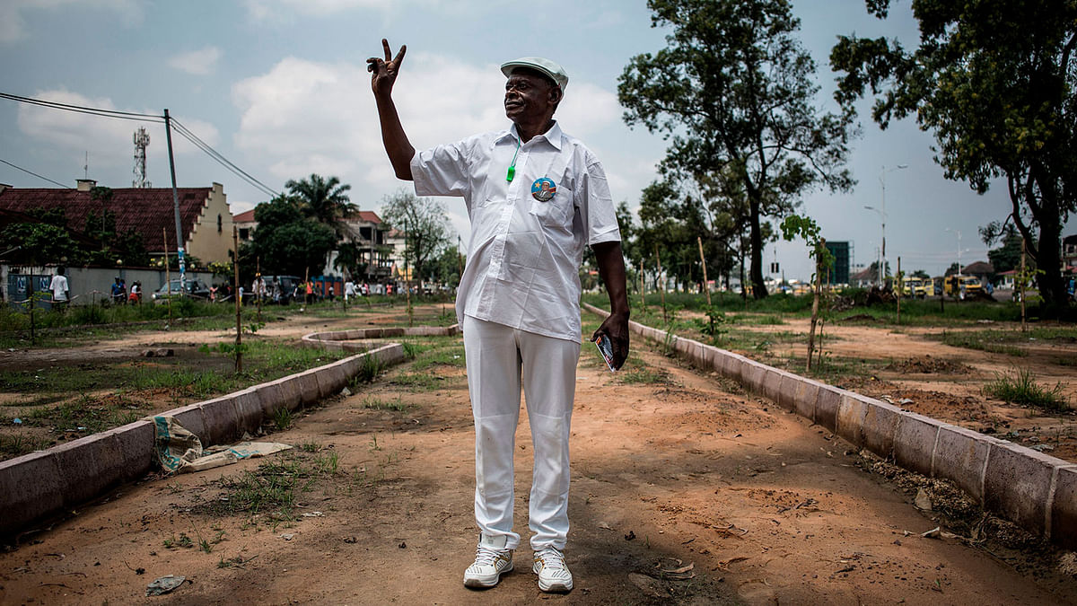 A supporter of Felix Tshisekedi, who was named provisional winner of Democratic Republic of Congo`s presidential election, celebrates outside the Union for Democracy and Social Progress (UDPS) headquarters in Kinshasa on 10 January. Photo: AFP