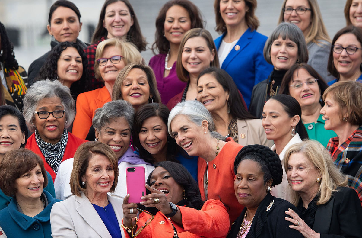 In this file photo taken on 4 January US Speaker of the House Nancy Pelosi (C L) takes a `selfie` with US Representative Terri Sewell (C R) as they stand with female House Democratic members of the 116th Congress for a photo opportunity outside the US Capitol in Washington, DC. Photo: AFP