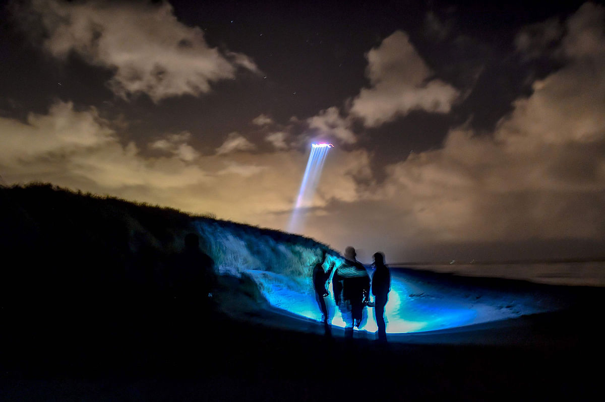 French gendarmes patrol while a police helicopter fly over the beach of Oye-Plage, near Calais, northern France, on 9 January 2019 as they try to intercept migrants attempting to cross the Channel. The number of migrants attempting to cross the Channel, one of the world`s busiest shipping lanes, rose to 504 last year, up from a mere 13 in 2017. Photo: AFP