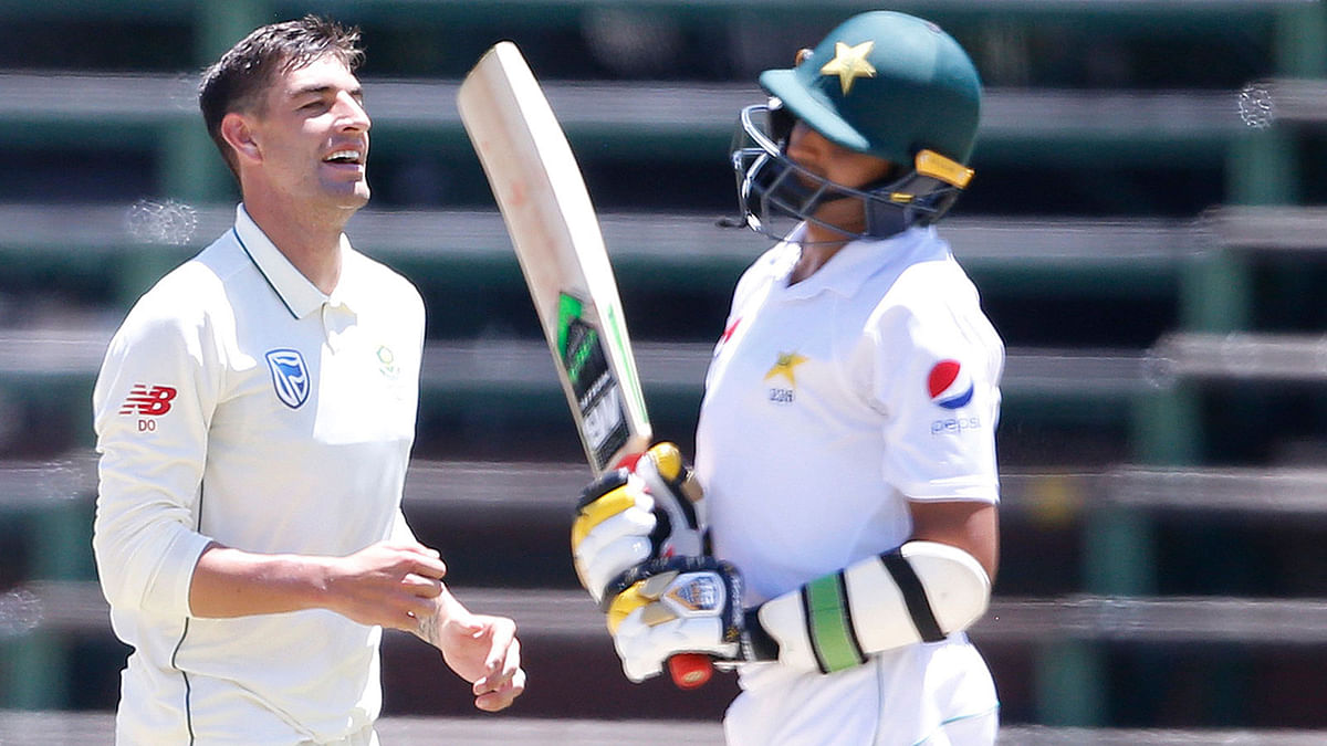 South African bowler Duanne Olivier (C) celebrates next to Pakistan batsman Mohammad Abbas (R) during the second day of the third Cricket Test match between South Africa and Pakistan at Wanderers cricket stadium on 12 January, 2019 in Johannesburg, South Africa. Photo: AFP