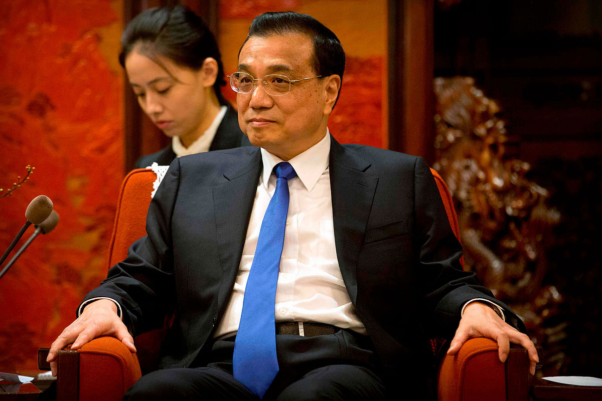 Chinese premier Li Keqiang listens during a meeting with Tesla CEO Elon Musk (not pictured) at the Zhongnanhai leadership compound in Beijing on 9 Januray. Photo: AFP