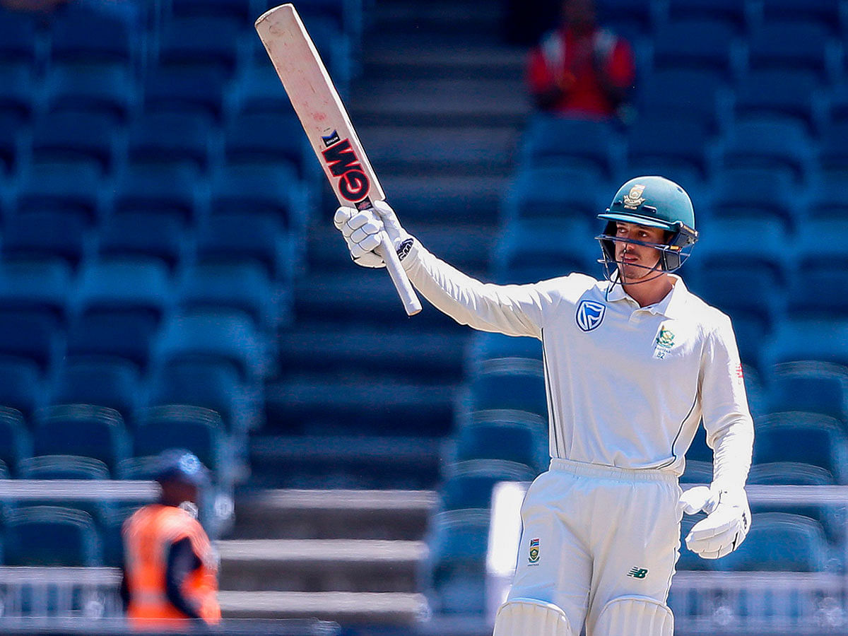 South Africa`s batsman Quinton de Kock raises his bat as he celebrates a half century (50 runs) during the third day of the third Cricket Test match between South Africa and Pakistan at Wanderers cricket stadium on 13 January 2019 in Johannesburg, South Africa. Photo: AFP