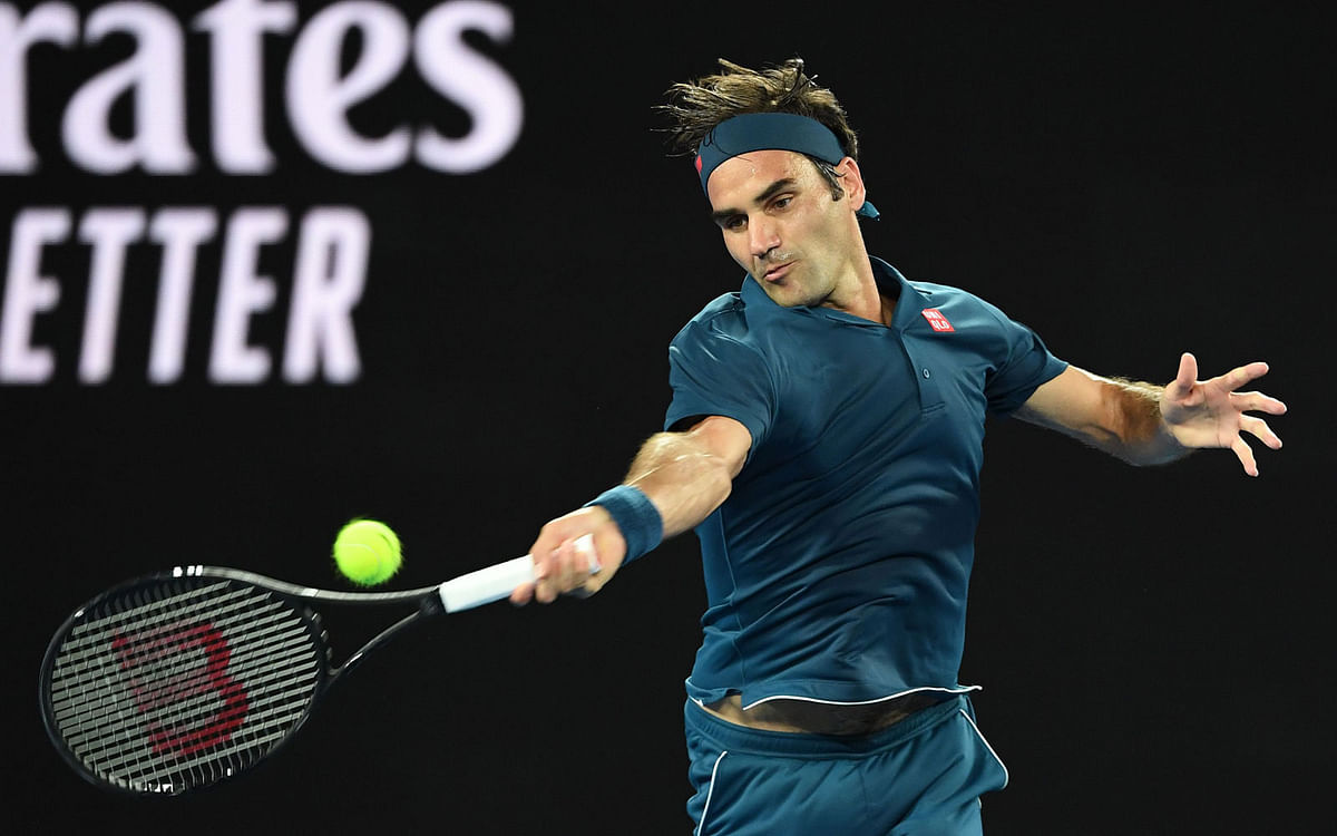 Switzerland`s Roger Federer hits a return against Uzbekistan`s Denis Istomin during their men`s singles match on day one of the Australian Open tennis tournament in Melbourne on 14 January 2019. Photo: AFP