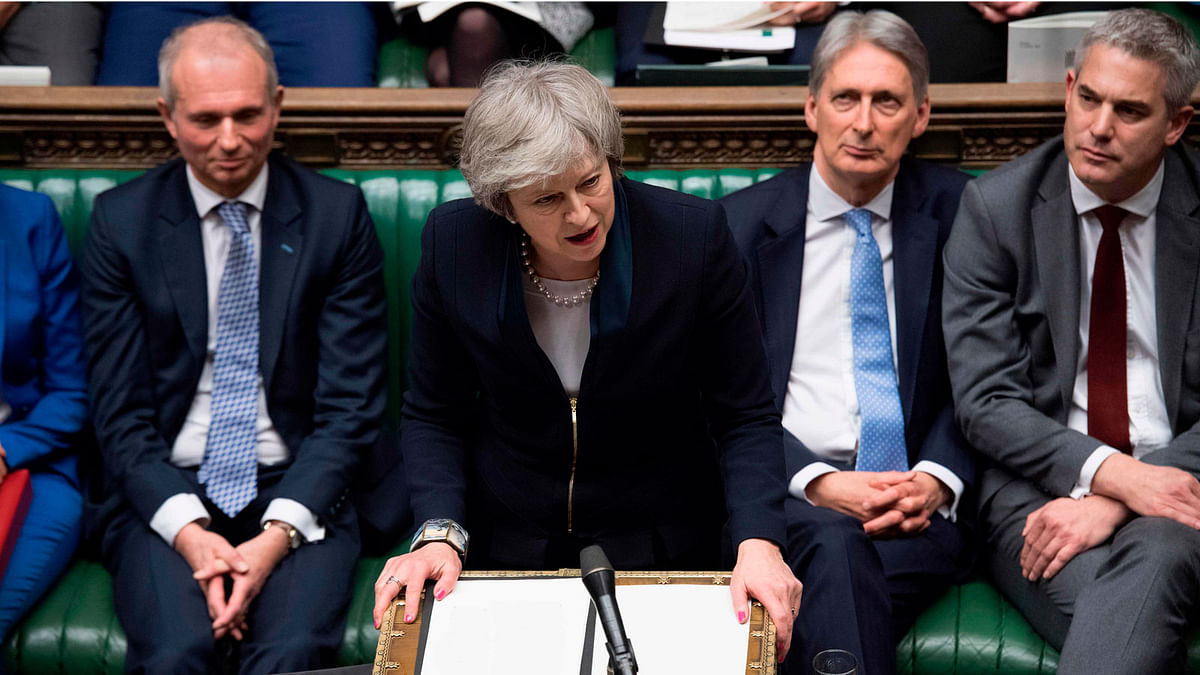 A handout photograph released by the UK Parliament shows Britain`s prime minister Theresa May (C) making a statement in the House of Commons in London on 15 January 2019 directly after MPs rejected the government`s Brexit deal. Photo: AFP