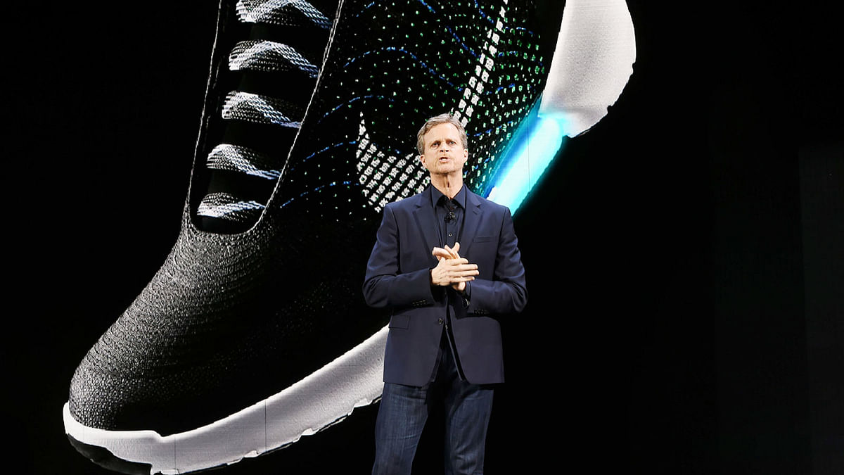 In this file photo taken on 16 March 2016, Nike president and CEO Mark Parker reveals their latest innovative sports products during an event in New York. Nike revealed a series of products highlighted by the groundbreaking “adaptive lacing” platform. Photo: AFP