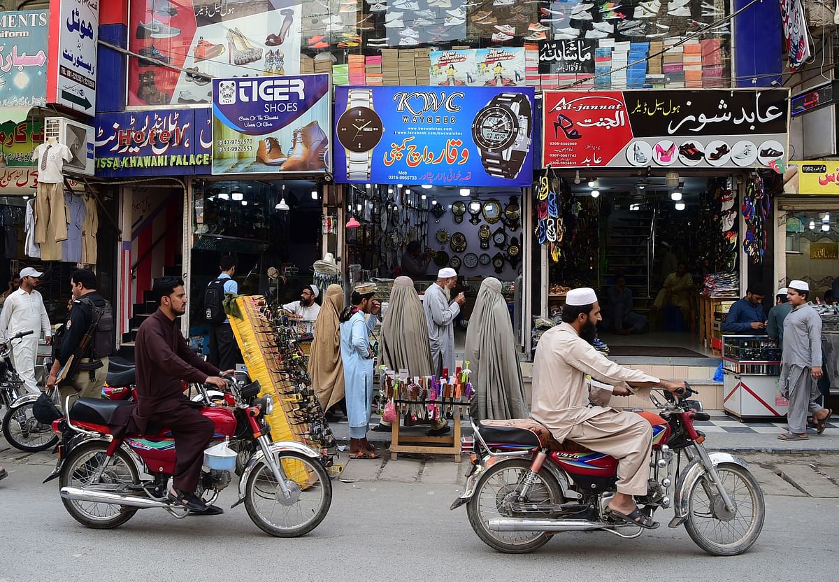 In this picture taken on 29 September 2018 Afghan refugees are pictured in the historic Qissa Khawani bazaar in Peshawar. Photo: AFP