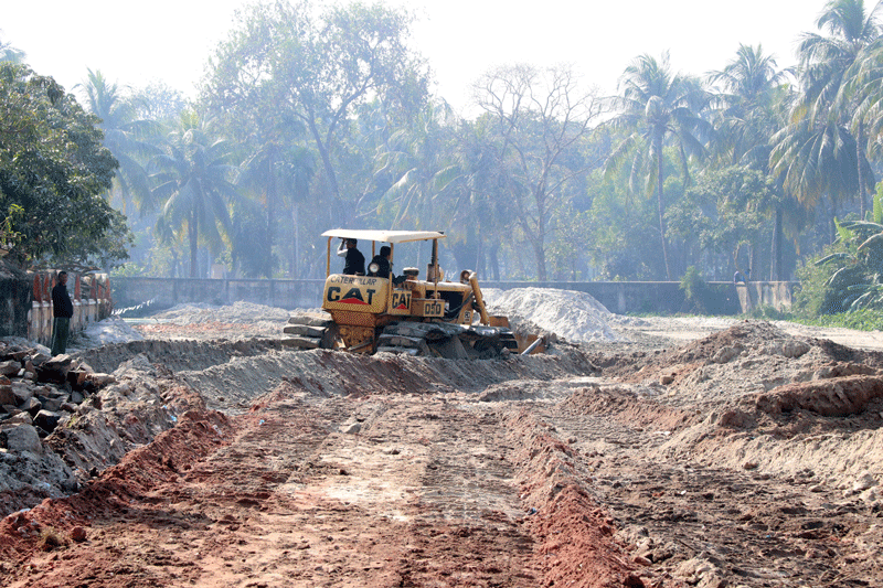 A 16 January photo shows that the pond near Haji Lal Muhammad Eidgah in Kadirganj area of Rajshahi city was being filled with dirt. Photo: Shahidul Islam