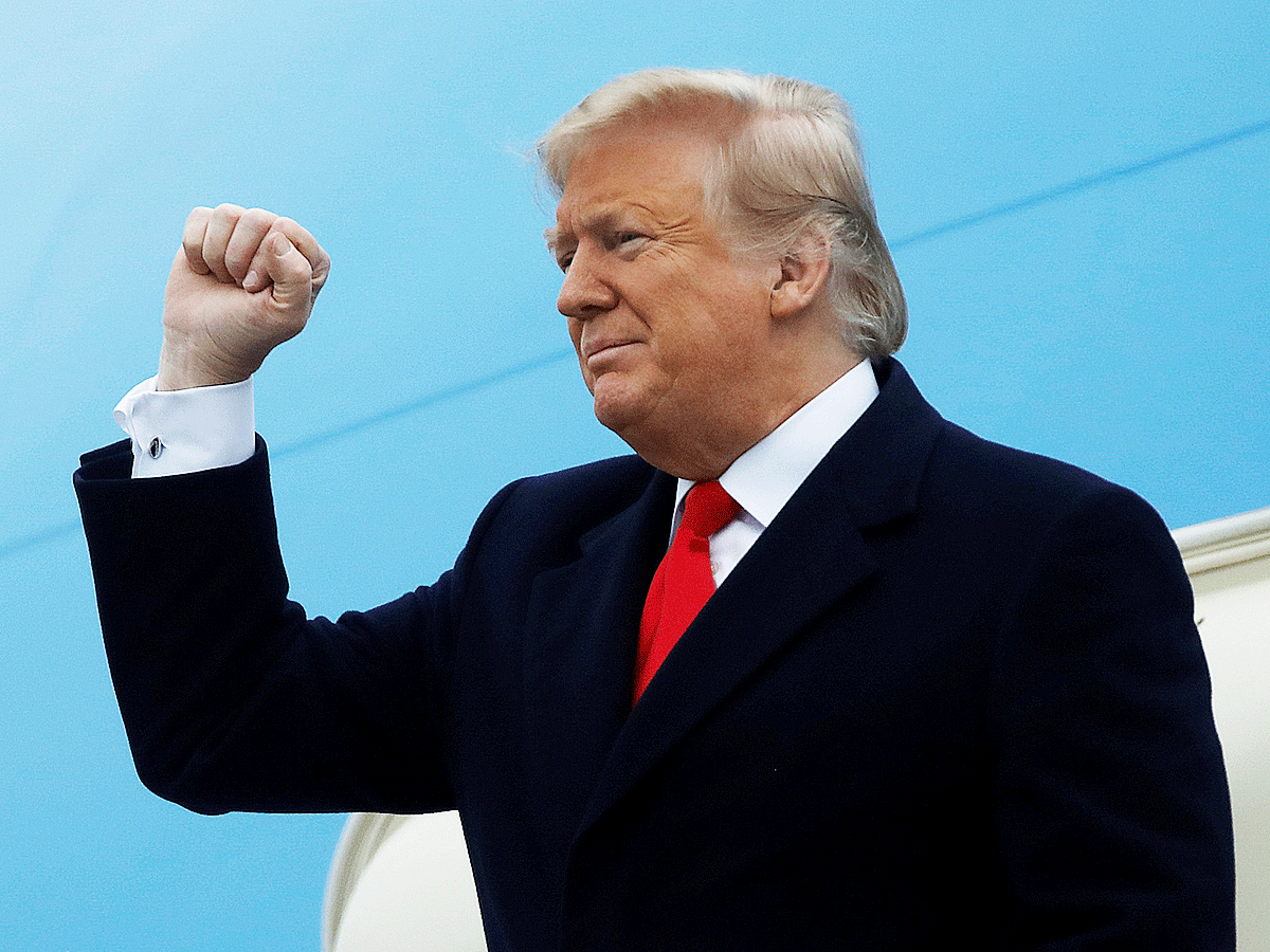 US president Donald Trump pumps his fist as he arrives at Louis Armstrong New Orleans International Airport prior to addressing the National Farm Bureau Federation`s 100th convention in New Orleans, Louisiana, US on 14 January. Photo: Reuters