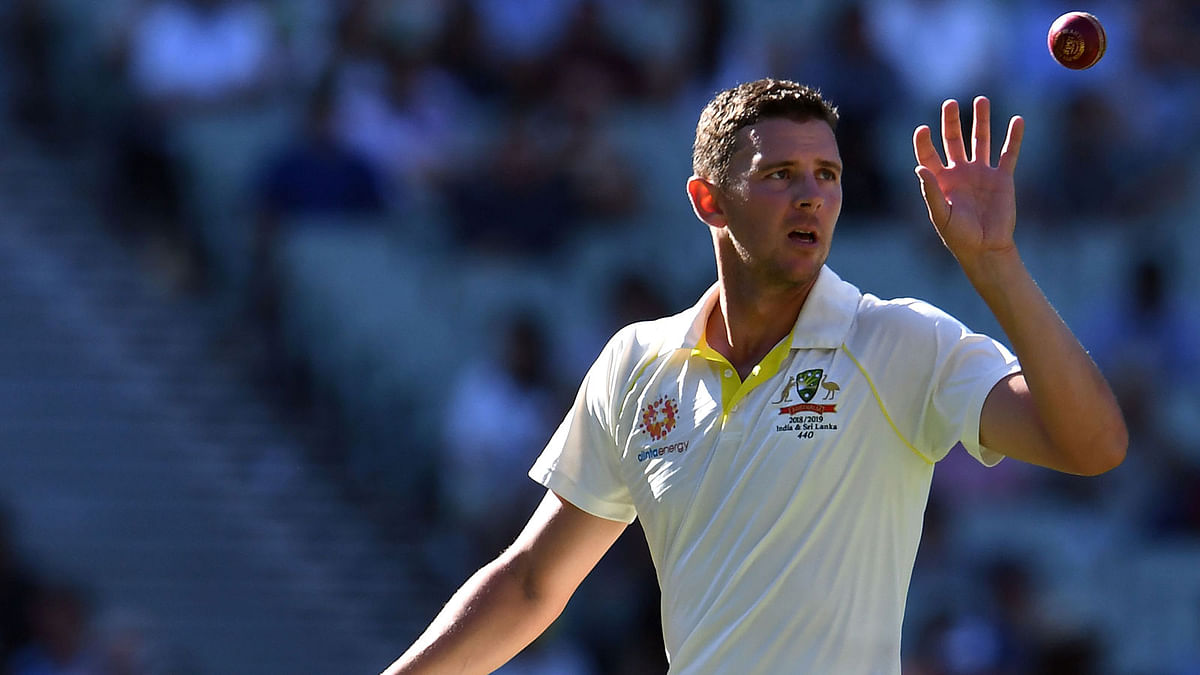 In this file photo taken on 26 December 2018, Australia`s paceman Josh Hazlewood prepares to bowl during day one of the third cricket Test match between Australia and India in Melbourne. Photo: AFP