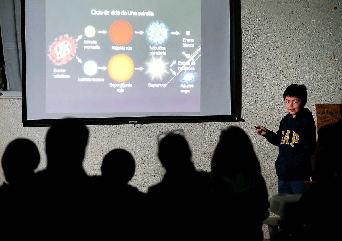 Ricardo Barriga, 10, speaks and teaches astronomy to adults and younger in hopes of raising money for his own astronaut suit, in Pirque, Chile on 16 January 2019. Photo: Reuters