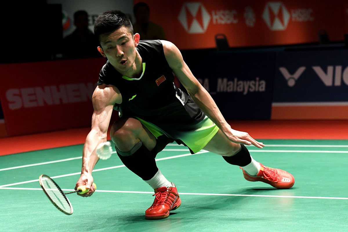 Chen Long of China hits a return against Viktor Axelsen of Denmark during the men`s singles semi-final match at the Malaysia Masters badminton tournament in Kuala Lumpur on 19 January, 2019. Photo: AFP