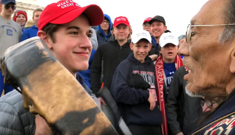 A student from Covington Catholic High School in Kentucky stands in front of Native American Vietnam veteran Nathan Phillips in Washington in this still image taken on 18 January vand the teens were recorded harrassing Phillips in a video that went viral -- Photo: Reuters