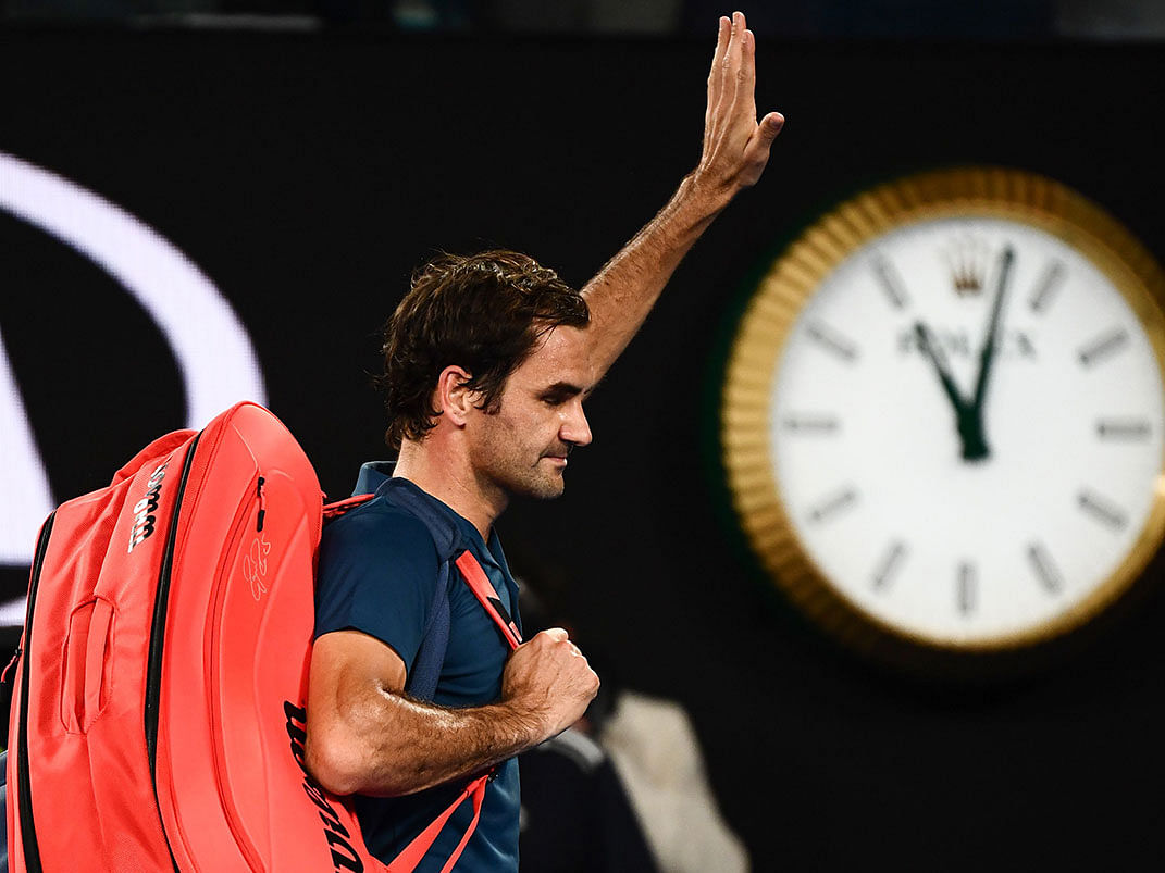 Switzerland`s Roger Federer leaves the court after his defeat against Greece`s Stefanos Tsitsipas during their men`s singles match on day seven of the Australian Open tennis tournament in Melbourne on 20 January 2019. Photo: AFP