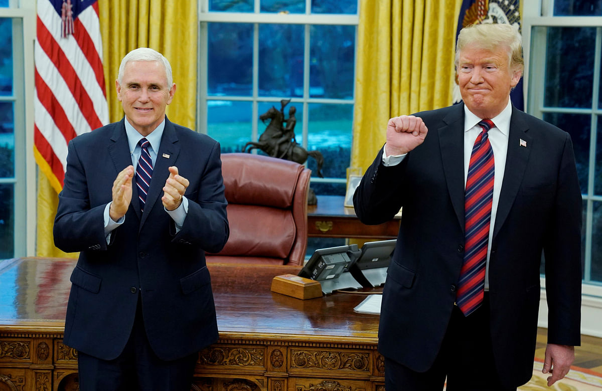 US president Donald Trump and vice president Mike Pence react during a Naturalisation Ceremony at the White House in Washington, US, on 19 January 2019. Reuters File Photo