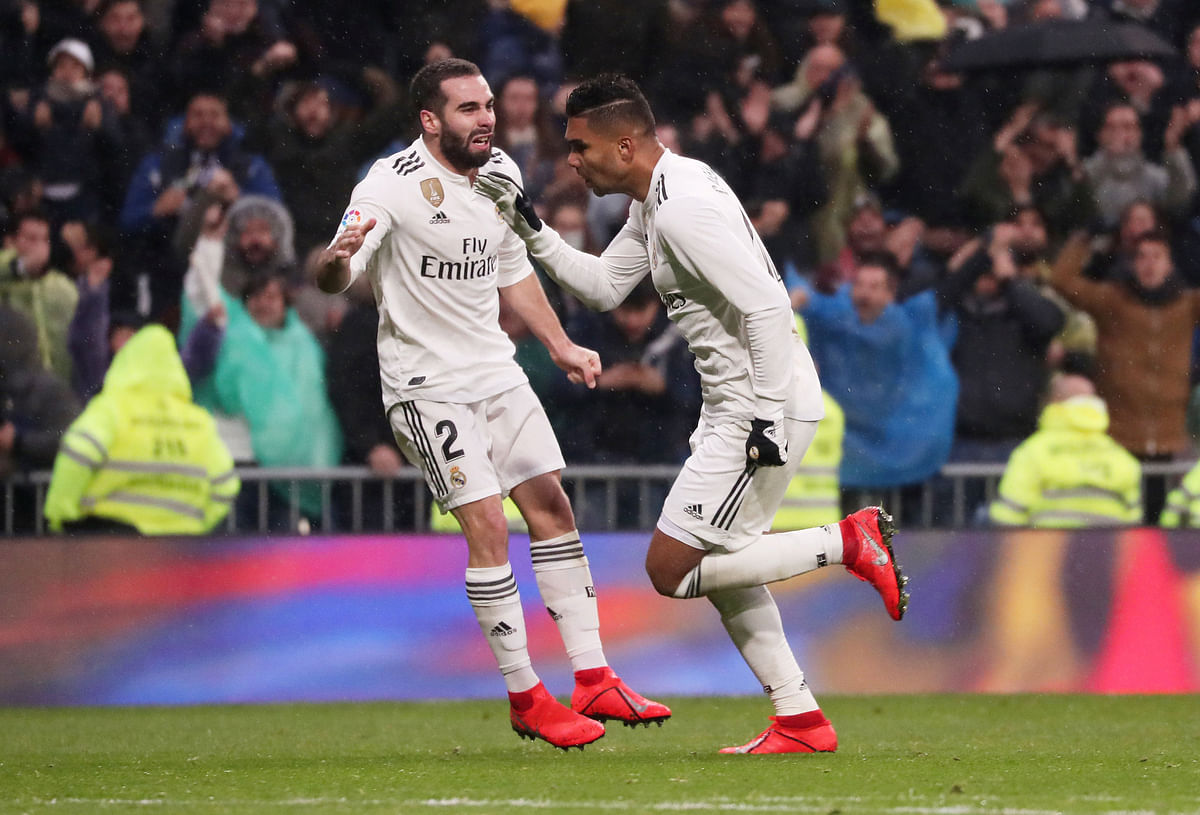 Real Madrid`s Casemiro celebrates scoring their first goal with Dani Carvajal in the La Liga match against Sevilla at Santiago Bernabeu, Madrid, Spain on 19 January 2019. Photo: Reuters