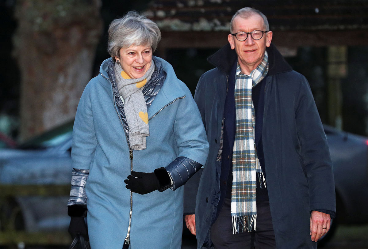 Britain`s prime minister Theresa May and her husband Philip arrive at church, near High Wycombe, Britain on 20 January. Photo: Reuters