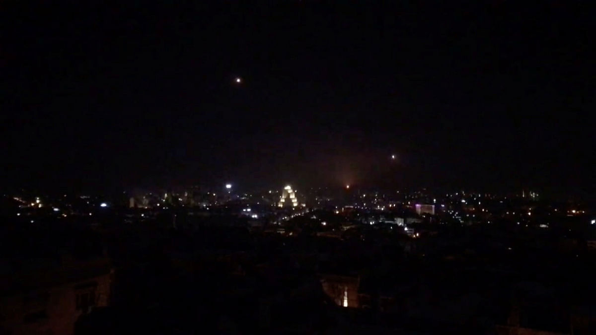 What is believed to be guided missiles are seen in the sky during what is reported to be an attack in Damascus, Syria, 21 January 2019, in this still image taken from a video obtained from social media. Photo: Reuters