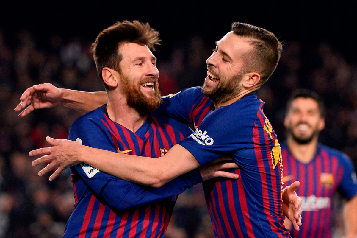 Barcelona`s Argentinian forward Lionel Messi (L) celebrates with Barcelona`s Spanish defender Jordi Alba after scoring during the Spanish League football match between Barcelona and Leganes at the Camp Nou stadium in Barcelona on 20 January, 2019. Photo: AFP