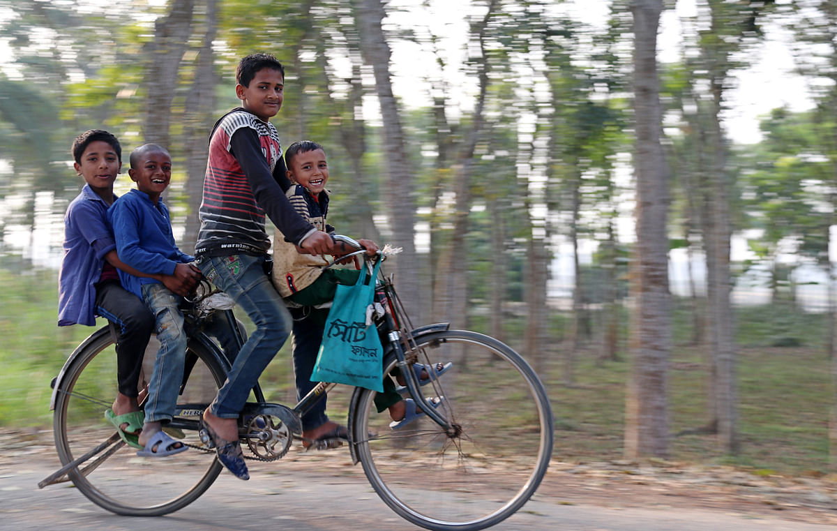 Children riding bicycle at Kashimpur, Jashore on 21 January. Photo: Ehsan-Ud-Doula