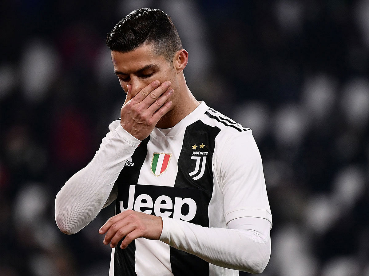 Juventus` Portuguese forward Cristiano Ronaldo reacts during the Italian Serie A football match Juventus vs Chievo Verona on 21 January, 2019 at the Juventus stadium in Turin. AFP