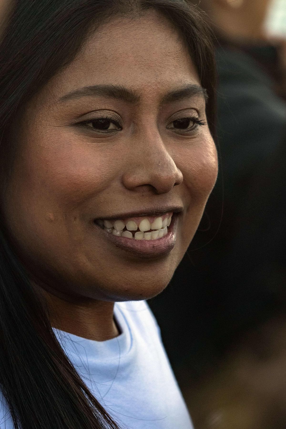 Mexican actress Yalitza Aparicio speaks to the media outside her trailer near the US-Mexico border where she is taking part in a production, in Tijuana, Baja California state, Mexico, on 22 January 2019. Aparicio, an indigenous Mexican woman, earned a best-actress nomination for the Oscars early Tuesday for her role in the Netflix film Roma. Photo: AFP