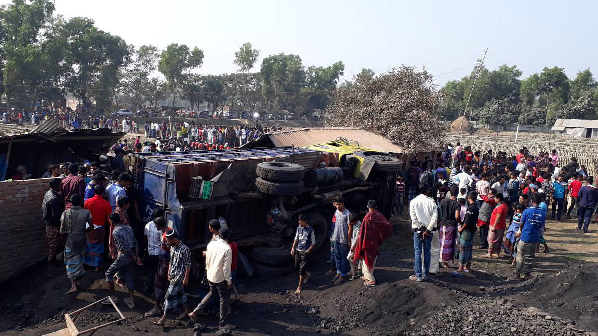 A coal-laden truck overturns on the labour shed of a brick kiln in Chouddagram upazila of Cumilla on Friday, leaving 13 people dead. Photo: UNB