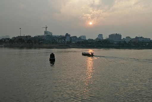 A boat crossing Hatirjheel, the only navigable canal of Dhaka, during sunset on 29 January. Photo: Nusrat Nowrin