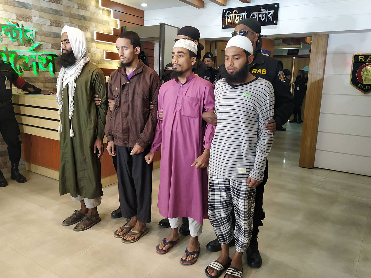 Members of Rapid Action Battalion (RAB) arrest four members of banned militant outfit Ansarullah Bangla Team (ABT) from different parts of the city early Friday. Photo: Prothom Alo