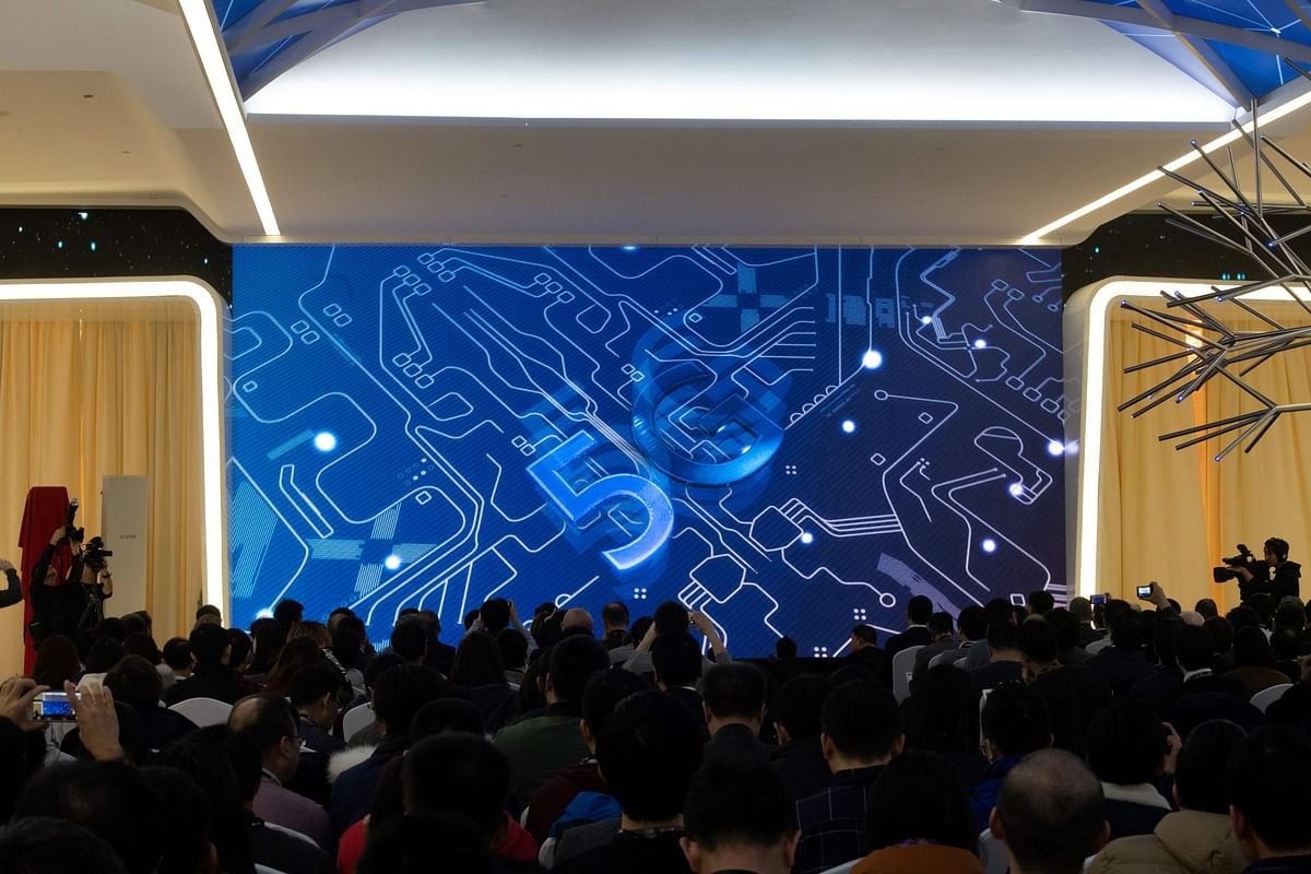 This file picture taken on 24 January 2019 shows journalists and guests watching a trailer during a press conference and launch of new 5G Huawei products at the Huawei Beijing Executive Briefing Centre in Beijing. Photo: AFP