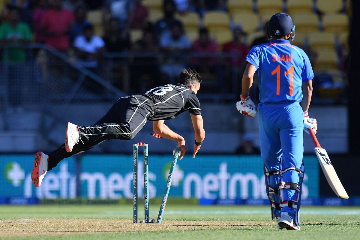 India`s Mohammed Shami (R) is run out by New Zealand`s Trent Boult (L) during the fifth one-day international (ODI) cricket match between New Zealand and India in Wellington on 3 February 2019. Photo: AFP