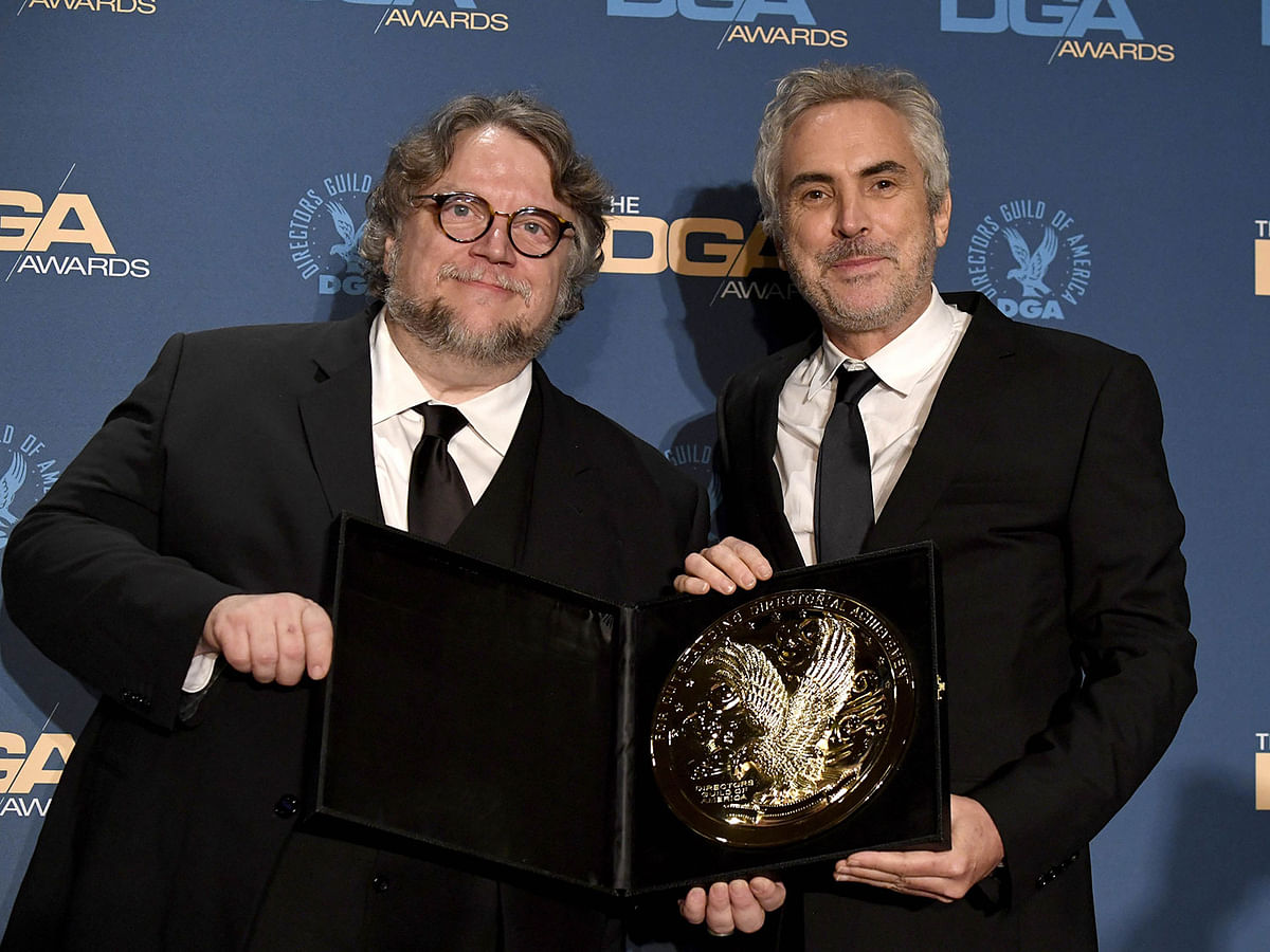 Guillermo del Toro (L) and 2018 DGA Feature Film Award winner for `Roma` Alfonso Cuaron pose in the press room during the 71st Annual Directors Guild Of America Awards at The Ray Dolby Ballroom at Hollywood & Highland Centre on 02 February, 2019 in Hollywood, California. Photo: AFP