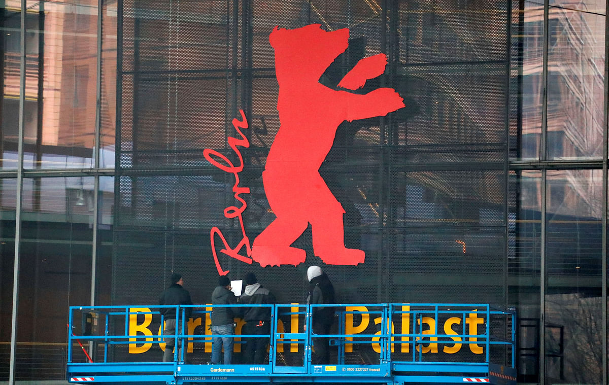 Workers attach the Berlinale mascot at the entrance to the venue of the upcoming Berlinale International Film Festival in Berlin, Germany, on 2 February 2019. Photo: Reuters