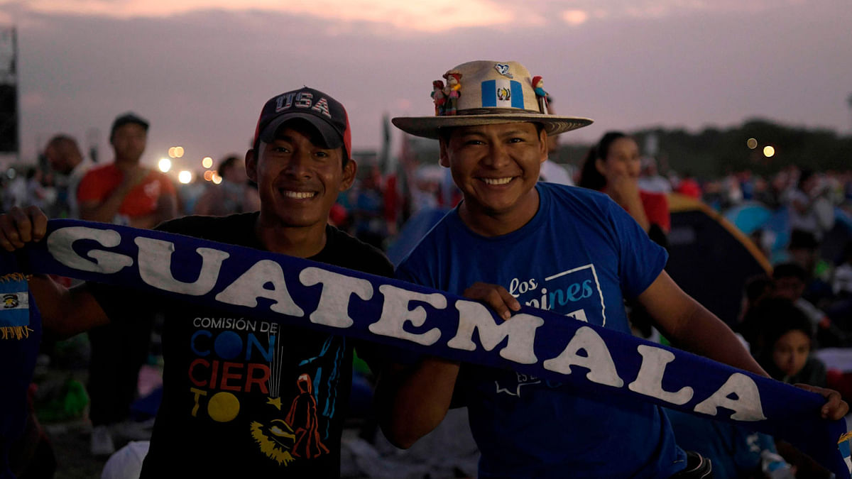 Pilgrims from Guatemala who took part in an evening vigil in the framework of World Youth Day are pictured in the morning before the arrival of Pope Francis to officiate an open-air mass at the Campo San Juan Pablo II on the outskirts of Panama City, on 27 January 2019. Photo: AFP