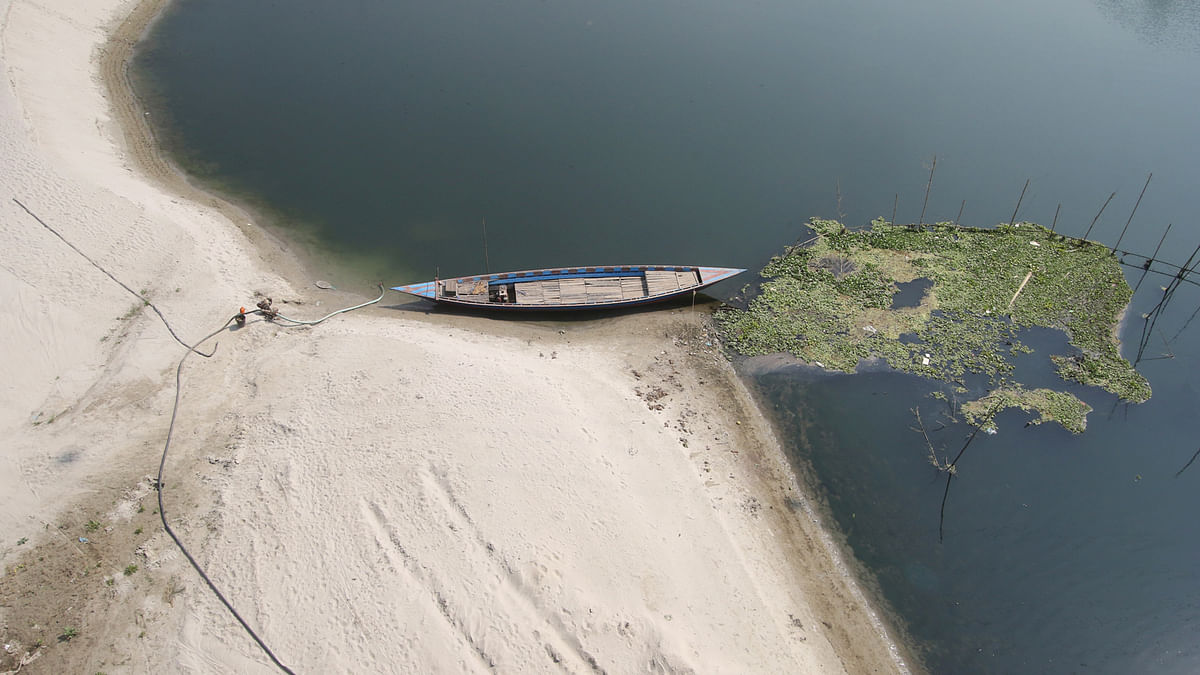 A boat shored against the bank of the river Kaliganga the waterlevel of which has reduced due to winter at Tora, Ghior in Manikganj on 2 February. Photo: Abdus Salam