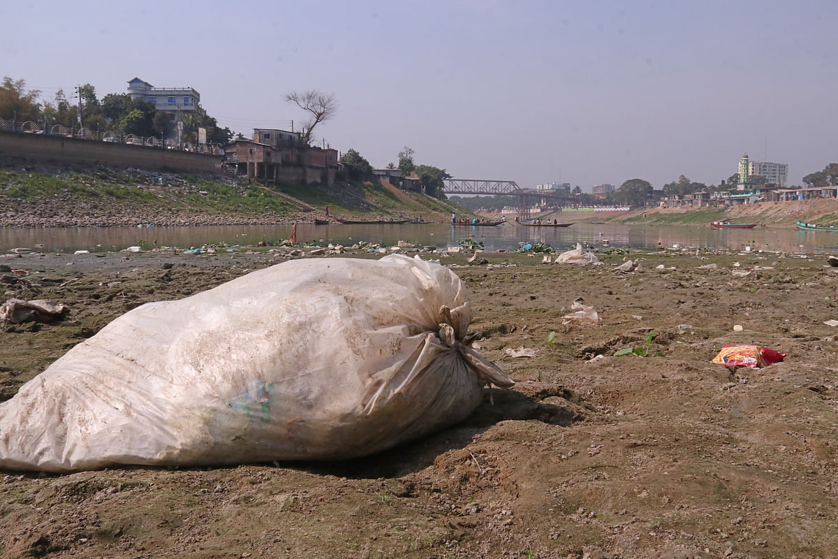 Garbage piles on dried bed of Surma river.